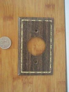 Old Electrical Outlet Cover Brown Gold Round Hole Steel Wood Grain Design