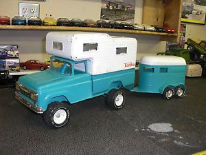 A Restored 1960 Ford Tonka Truck and camper Pulling A Nylint Horse Trailer